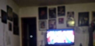 LGBTQ+ Representation in Media: How It’s Evolving and Why It Matters Dim living room at night with TV glow, Pride pins, empty takeout container.