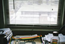 LGBTQ+ History for Educators: The Ultimate Guide to Inclusive Teaching Messy Teacher's Desk with ACT UP Posters and Rainbow Tape