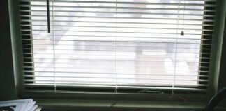 LGBTQ+ History for Educators: The Ultimate Guide to Inclusive Teaching Messy Teacher's Desk with ACT UP Posters and Rainbow Tape