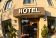 How to Find LGBTQ+ Friendly Hotels and Accommodations? Selfie at LGBTQ+ Friendly Hotel Entrance, Golden Hour
