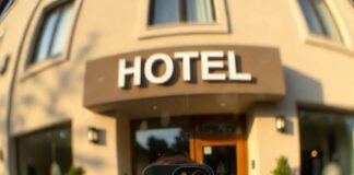 How to Find LGBTQ+ Friendly Hotels and Accommodations? Selfie at LGBTQ+ Friendly Hotel Entrance, Golden Hour